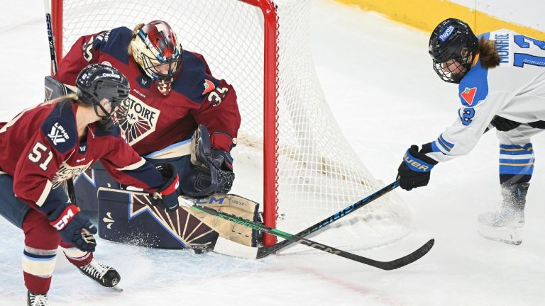 Toronto Sceptres' Allie Munroe (12) tries a wraparound on Montreal Victoire goaltender Ann-Renee Desbiens (35) as Victoire's Kelly Ann Nadeau (51) defends during first period PWHL hockey action in Laval, Que. Sunday, December 7, 2025.(Graham Hughes/CP)