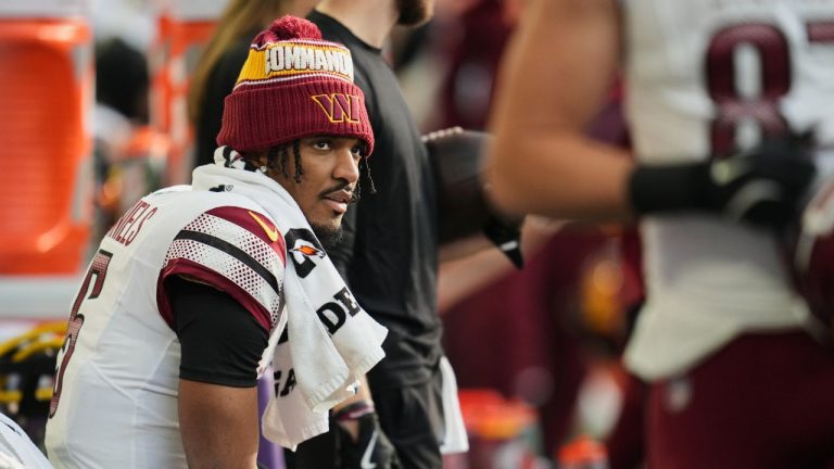 Washington Commanders quarterback Jayden Daniels on the bench before a game against the Minnesota Vikings, Sunday, Dec. 7, 2025, in Minneapolis. (AP Photo/Abbie Parr)