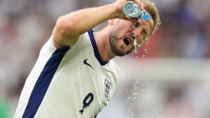 England's Harry Kane hydrates during a break in play in a round of sixteen match between England and Slovakia at the Euro 2024 soccer tournament in Gelsenkirchen, Germany, Sunday, June 30, 2024. (AP Photo/Matthias Schrader)