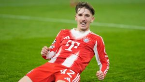Bayern's Lennart Karl celebrates after scoring his side's second goal during the Champions League match between FC Bayern Munich and Sporting CP in Munich, Germany, Tuesday, Dec. 9, 2025. (AP Photo/Matthias Schrader)