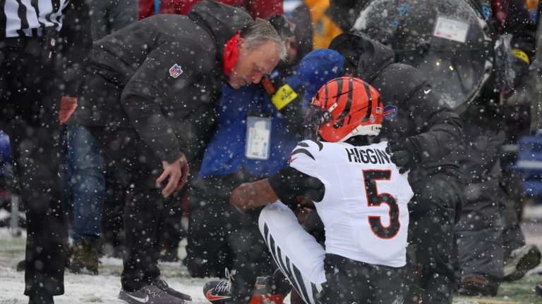 Cincinnati Bengals wide receiver Tee Higgins (5) is tended to during the first half of an NFL football game against the Buffalo Bills, Sunday, Dec. 7, 2025, in Orchard Park, N.Y. (Jeffrey T. Barnes/AP)
