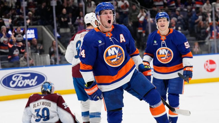 New York Islanders' Bo Horvat (14) reacts after scoring during the second period of an NHL hockey game against the Colorado Avalanche, Thursday, Dec. 4, 2025, in Elmont, N.Y. (Seth Wenig/AP)
