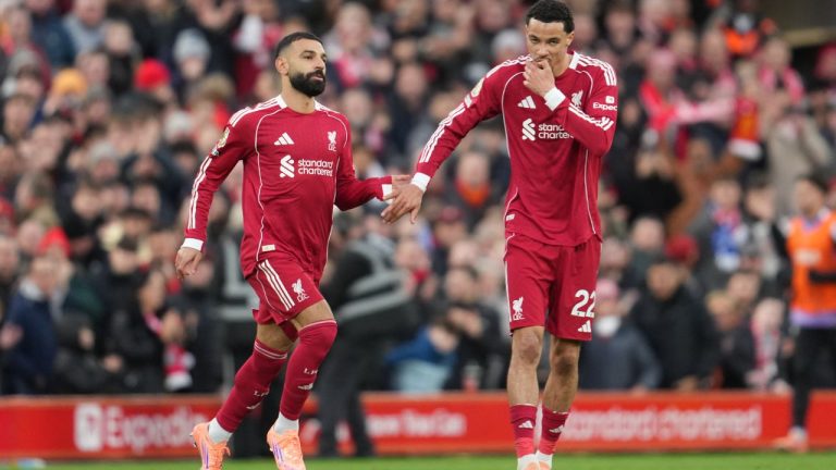 Liverpool's Mohamed Salah, left, and Hugo Ekitike during the English Premier League match between Liverpool and Brighton and Hove Albion in Liverpool, England, Saturday, Dec. 13, 2025. (AP Photo/Jon Super)