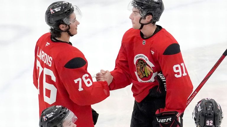 Chicago Blackhawks left winger Nick Lardis (76) and centre Frank Nazar at the team's hockey camp Thursday, Sept. 19, 2024, in Chicago. (AP Photo/Charles Rex Arbogast)