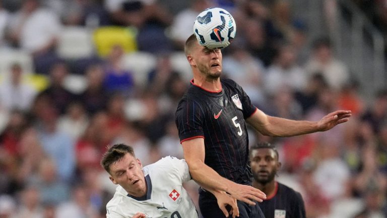 United States defender Walker Zimmerman (5) heads the ball over Switzerland midfielder Michel Aebischer during an international friendly match Tuesday, June 10, 2025, in Nashville, Tenn. (AP Photo/George Walker IV)
