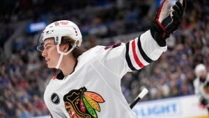 Chicago Blackhawks' Connor Bedard celebrates after scoring during the first period of an NHL hockey game against the St. Louis Blues Saturday, Dec. 23, 2023, in St. Louis. (Jeff Roberson/AP)