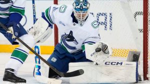 Vancouver Canucks goaltender Thatcher Demko (35) catches the puck during the third period of a game against New York Rangers, Tuesday, Dec. 16, 2025, in New York. (AP Photo/Yuki Iwamura)