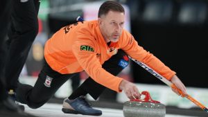 Skip Brad Gushue delivers a stone during Canadian Olympic curling trials action against Team Jacobs in Halifax on Wednesday, November 26, 2025. (Darren Calabrese/THE CANADIAN PRESS)