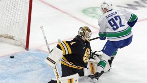 Boston Bruins goalie Jeremy Swayman couldn't stop the puck as the Vancouver Canucks Liam Ohgren scored in the shootout with a goal that eventually gave Vancouver a 5-4 victory on Saturday, Dec. 20, 2025, in Boston. (AP Photo/Jim Davis)