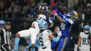 Toronto Argonauts' Royce Metchie (9) looks on as teammate Toronto Argonauts' Benjie Franklin (23) intercepts a pass meant for Winnipeg Blue Bombers' Keric Wheatfall (88) during first half CFL football action at the 111th Grey Cup in Vancouver, B.C., Sunday, Nov. 17, 2024. (Ethan Cairns/THE CANADIAN PRESS)
