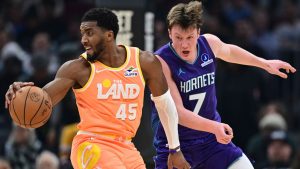 Cleveland Cavaliers guard Donovan Mitchell (45) spins around Charlotte Hornets guard Kon Knueppel (7) in the first half of an NBA basketball game, Monday, Dec. 22, 2025, in Cleveland. (David Dermer/AP)