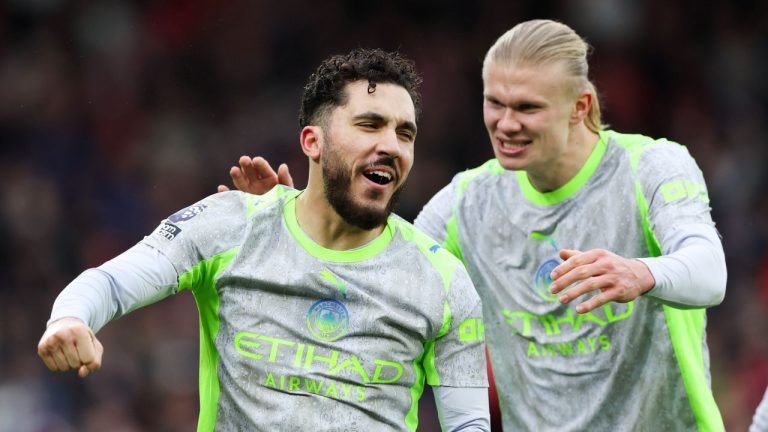 Manchester City's Rayan Cherki, left, celebrates with Erling Haaland after scoring his side's second goal during the Premier League match between Nottingham Forest and Manchester City, in Nottingham, England, Saturday Dec. 27, 2025. (Barrington Coombs/PA via AP)