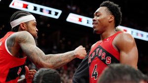 Toronto Raptors forward Brandon Ingram (3) and teammate Scottie Barnes (4) celebrate following their overtime win over the Golden State Warriors at the end of NBA basketball action in Toronto, Sunday, Dec. 28, 2025. (Frank Gunn/THE CANADIAN PRESS)
