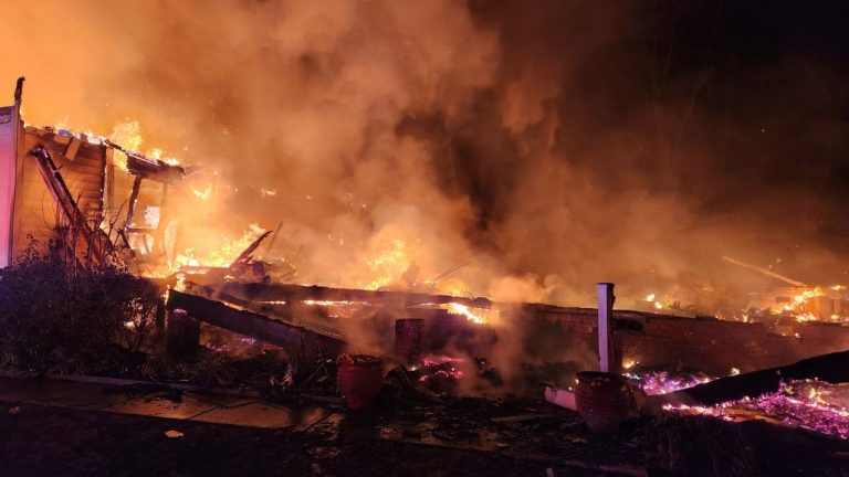 Flames from a house fire fill the air late Sunday, Dec. 28, 2025 in Stanley, N.C. (Brian Lee Weyeneth/Lucia-Riverbend Fire Department/AP)