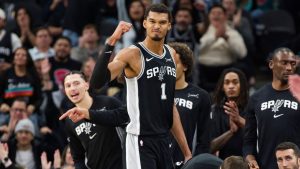 San Antonio Spurs centre Victor Wembanyama (1) celebrates a basket during the second half of an NBA basketball game against the New York Knicks, Wednesday, Dec. 31, 2025, in San Antonio. (Darren Abate/AP)