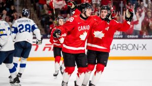 Canada's Brady Martin (28) celebrates his goal with teammate Cole Beaudoin (26) during first period IIHF World Junior Championship hockey action against Finland in Minneapolis on Wednesday, Dec. 31, 2025. (Christopher Katsarov/THE CANADIAN PRESS)