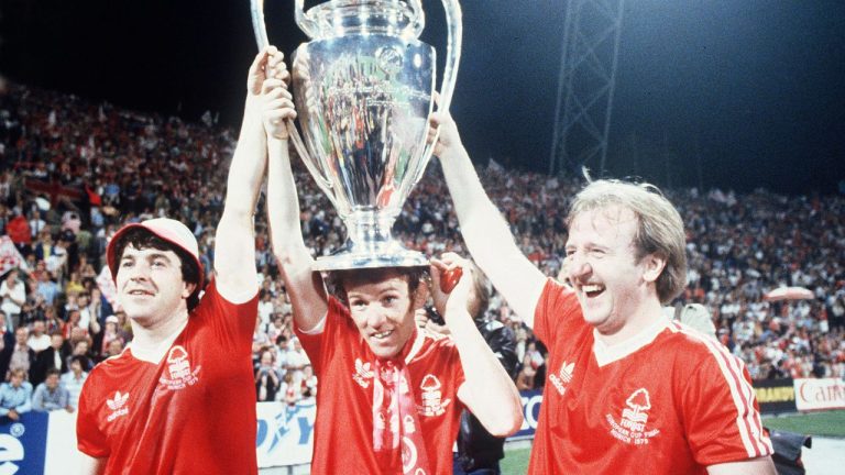 Nottingham Forest's John Robertson, left, Ian Bowyer, centre, and Kenny Burns, right, carry the European Cup in triumph after their 1-0 win against Malmo FF in Munich, Germany, May 30, 1979. (AP Photo)