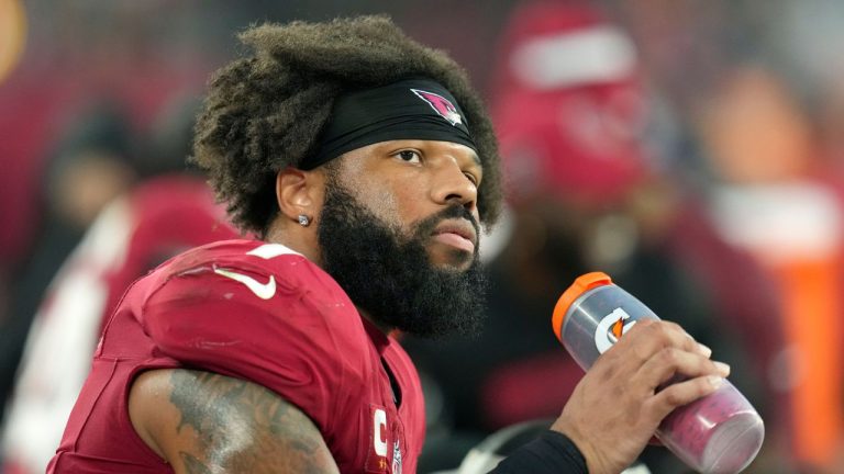 Arizona Cardinals linebacker Kyzir White pauses on the team bench during the second half of an NFL football game against the San Francisco 49ers Sunday, Jan. 5, 2025, in Glendale, Ariz. The Cardinals won 47-24. (AP Photo/Ross D. Franklin)