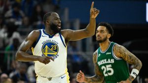 Golden State Warriors forward Draymond Green (23) celebrates a three-point basket against the Dallas Mavericks during the first half of an NBA basketball game, Thursday, Dec. 25, 2025, in San Francisco. (AP Photo/Eakin Howard)