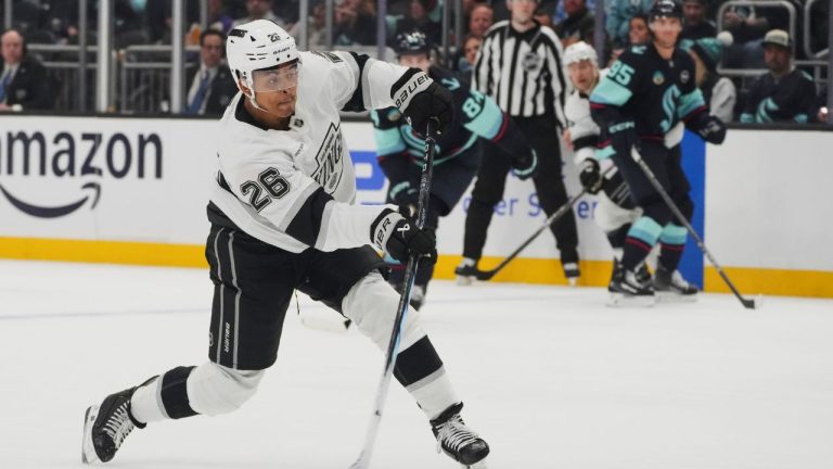 Los Angeles Kings centre Akil Thomas (26) shoots against the Seattle Kraken during the third period of an NHL hockey game Tuesday, April 15, 2025, in Seattle. (Lindsey Wasson/AP)