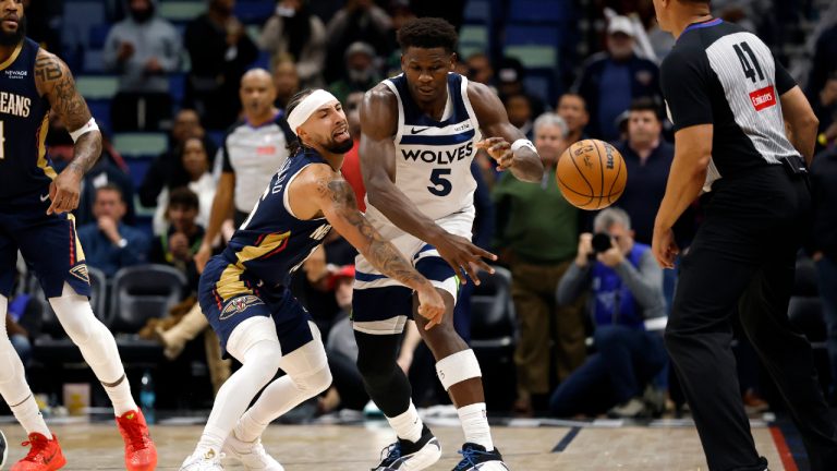 Minnesota Timberwolves guard Anthony Edwards (5) is defended by New Orleans Pelicans guard Jose Alvarado (15) in the second half of an NBA basketball game in New Orleans, Tuesday, Dec. 2, 2025. (Tyler Kaufman/AP)