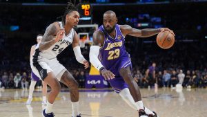Los Angeles Lakers forward LeBron James (23) drives past San Antonio Spurs guard Devin Vassell (24) during the first half of an NBA Cup basketball game Wednesday, Dec. 10, 2025, in Los Angeles. (Jae C. Hong/AP)