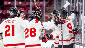 Canada's Michael Hage (29), second from right, celebrates his game winning goal with teammates in overtime IIHF World Junior Championship hockey action against Latvia. (Christopher Katsarov/THE CANADIAN PRESS)
