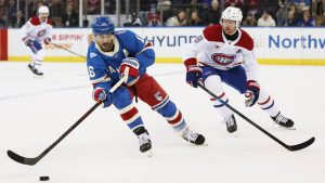 Montréal Canadiens' Mike Matheson (8) defends New York Rangers' Vincent Trocheck (16) in the first period of an NHL hockey game, Saturday, Dec. 13, 2025, in New York. (Heather Khalifa/AP Photo)