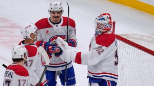 Montreal Canadiens goaltender Jacob Fowler (32) is congratulated after defeating the Boston Bruins following an NHL hockey game, Tuesday, Dec. 23, 2025, in Boston. (Charles Krupa/AP)