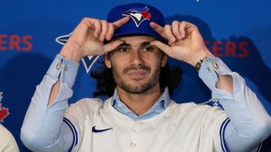 Dylan Cease adjusts his cap during a news conference at the Major League Baseball's Winter Meetings, Tuesday, Dec. 9, 2025, in Orlando, Fla. (John Raoux/AP Photo)