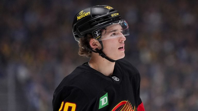 Vancouver Canucks' Braeden Cootes looks on during a stoppage in play during the first period of an NHL hockey game against the Calgary Flames, in Vancouver, on Thursday, October 9, 2025. (Darryl Dyck/THE CANADIAN PRESS)