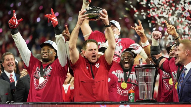 Indiana head coach Curt Cignetti holds up the championship trophy after the Big Ten championship NCAA college football game against Ohio State in Indianapolis, Saturday, Dec. 6, 2025. (Michael Conroy/AP)