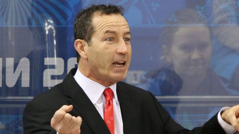 Canada head coach Kevin Dineen reacts to a penalty call against Team Canada in the second period of the game against Finland at the 2014 Winter Olympics women's hockey match at Shayba Arena, Monday, Feb. 10, 2014, in Sochi, Russia. (J. David Ake/AP Photo)