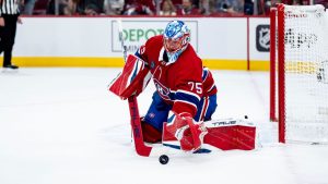 Montreal Canadiens goaltender Jakub Dobes (75) makes a save during second-period playoff action against the Washington Capitals in Montreal on Friday, April 25, 2025. (Christopher Katsarov/CP)