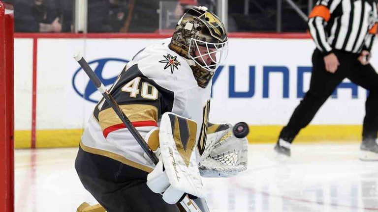 Vegas Golden Knights goaltender Akira Schmid, left, makes a save during the second period of an NHL hockey game against the New Jersey Devils, Friday, Dec. 5, 2025, in Newark, N.J. (Adam Hunger/AP)