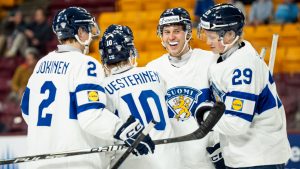 Finland's Roope Vesterinen (10) celebrates his goal with teammates Mitja Jokinen (2), Leo Tuuva (23) and Jasper Kuhta (29) after scoring during second period IIHF World Junior Championship hockey action against Denmark, in Minneapolis, Friday, Dec. 26, 2025. (Christopher Katsarov/CP)
