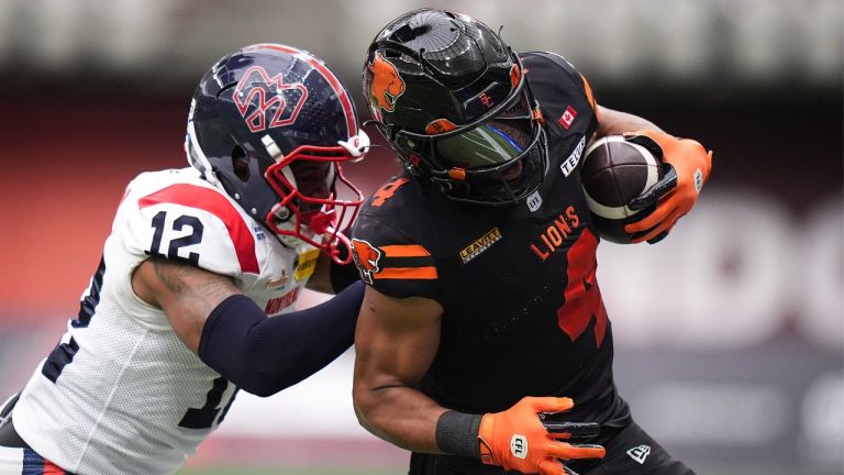 B.C. Lions' Keon Hatcher (4) is shoved by Montreal Alouettes' Najee Murray (12) after making a reception during the first half of a CFL football game, in Vancouver, on Saturday, August 16, 2025. (Darryl Dyck/THE CANADIAN PRESS)