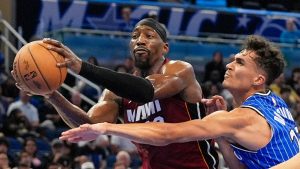 Miami Heat centre Bam Adebayo, left, grabs a rebound away from Orlando Magic forward Tristan da Silva during the second half of an NBA basketball game, Friday, Dec. 5, 2025, in Orlando, Fla. (John Raoux/AP)
