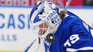 Toronto Maple Leafs goaltender Dennis Hildeby (35) makes a save on a high shot during first period NHL hockey action against the Montréal Canadiens in Toronto on Saturday, Dec. 6, 2025. (Frank Gunn/CP)