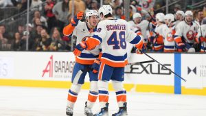 New York Islanders centre Mathew Barzal (13) celebrates his goal with defenceman Matthew Schaefer (48) against the Vegas Golden Knights in the third period of an NHL hockey game Thursday, Nov. 13, 2025, in Las Vegas. (Candice Ward/AP)
