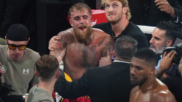 Jake Paul, centre, reacts after losing the heavyweight boxing match against Anthony Joshua, Friday, Dec. 19, 2025, in Miami, Fla. (Lynne Sladky/AP)