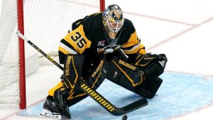 Pittsburgh Penguins goaltender Tristan Jarry makes a save during the third period of an NHL hockey game against the St. Louis Blues, Monday, Oct. 27, 2025, in Pittsburgh. (AP Photo/Matt Freed)