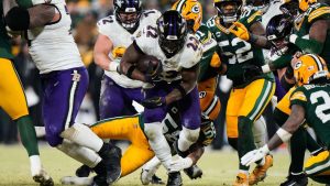 Baltimore Ravens running back Derrick Henry (22) runs the ball against the Green Bay Packers during the second half of an NFL football game, Saturday, Dec. 27, 2025, in Green Bay, Wis. (Morry Gash/AP)