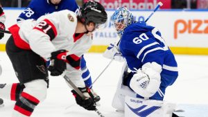 Ottawa Senators centre Nick Cousins (21) scores on Toronto Maple Leafs goaltender Joseph Woll (60) during first period NHL hockey action in Toronto, Saturday, Dec. 27, 2025. (Frank Gunn/CP)