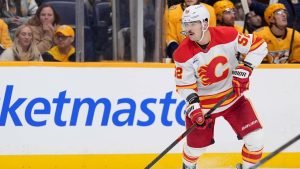 Calgary Flames defenceman Mackenzie Weegar (52) handles the puck during the third period of an NHL hockey game Saturday, Nov. 1, 2025, in Nashville, Tenn. (Camden Hall/AP)