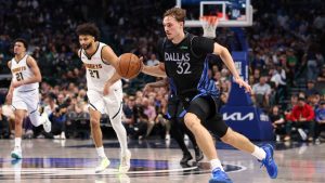 Dallas Mavericks forward Cooper Flagg (32) brings the ball up the court during the third quarter of an NBA basketball game against the Denver Nuggets Tuesday, Dec. 23, 2025, in Dallas. (Sam Hodde/AP)