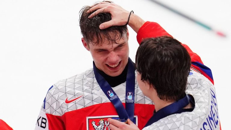 Czechia defenceman Vojtech Husinecky (9) congratulates teammate Adam Novotny (24) after the team beat Sweden to take the World Junior hockey championship bronze medal, in Ottawa, Sunday, Jan. 5, 2025. (Sean Kilpatrick/THE CANADIAN PRESS)