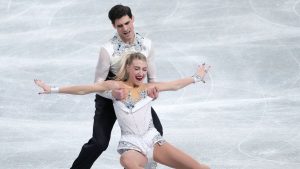 Piper Gilles and Paul Poirier, of Canada, compete in the ice dance's rhythm dance segment at the ISU Grand Prix of Figure Skating Final in Nagoya, central Japan, Thursday, Dec. 4, 2025. (Hiro Komae/AP Photo)