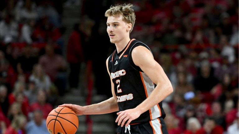 Pacific forward Elias Ralph (2) runs a play against Arkansas during an NCAA college basketball game Monday, Nov. 18, 2024, in Fayetteville, Ark. (Michael Woods/AP Photo)