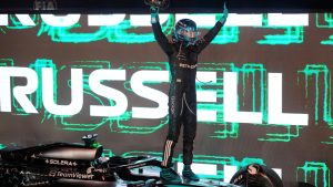 Mercedes driver George Russell of Britain celebrates after winning the Singapore Formula One Grand Prix at the Marina Bay Street Circuit in Singapore, Sunday, Oct. 5, 2025. (Vincent Thian/AP)